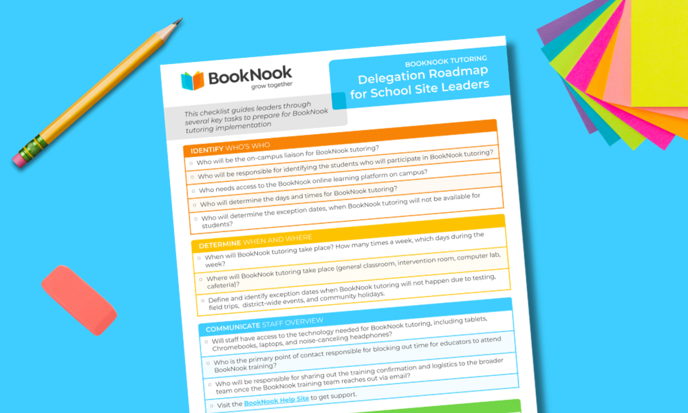 Print out of the BookNook Tutoring -Delegation Roadmap for School Site Leaders page on a bright blue background surrounded by a pencil, pink rubber eraser and a stack of rainbow post-it notes.